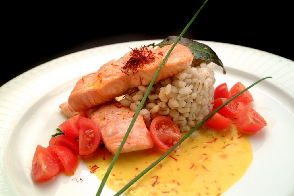 Italian food recipes, salmon with boiled barley and saffron sauce