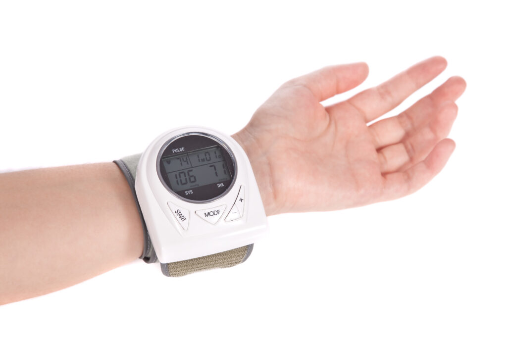 Measuring the blood pressure with a wrist sphygmomanometer (blood pressure measure equipment)