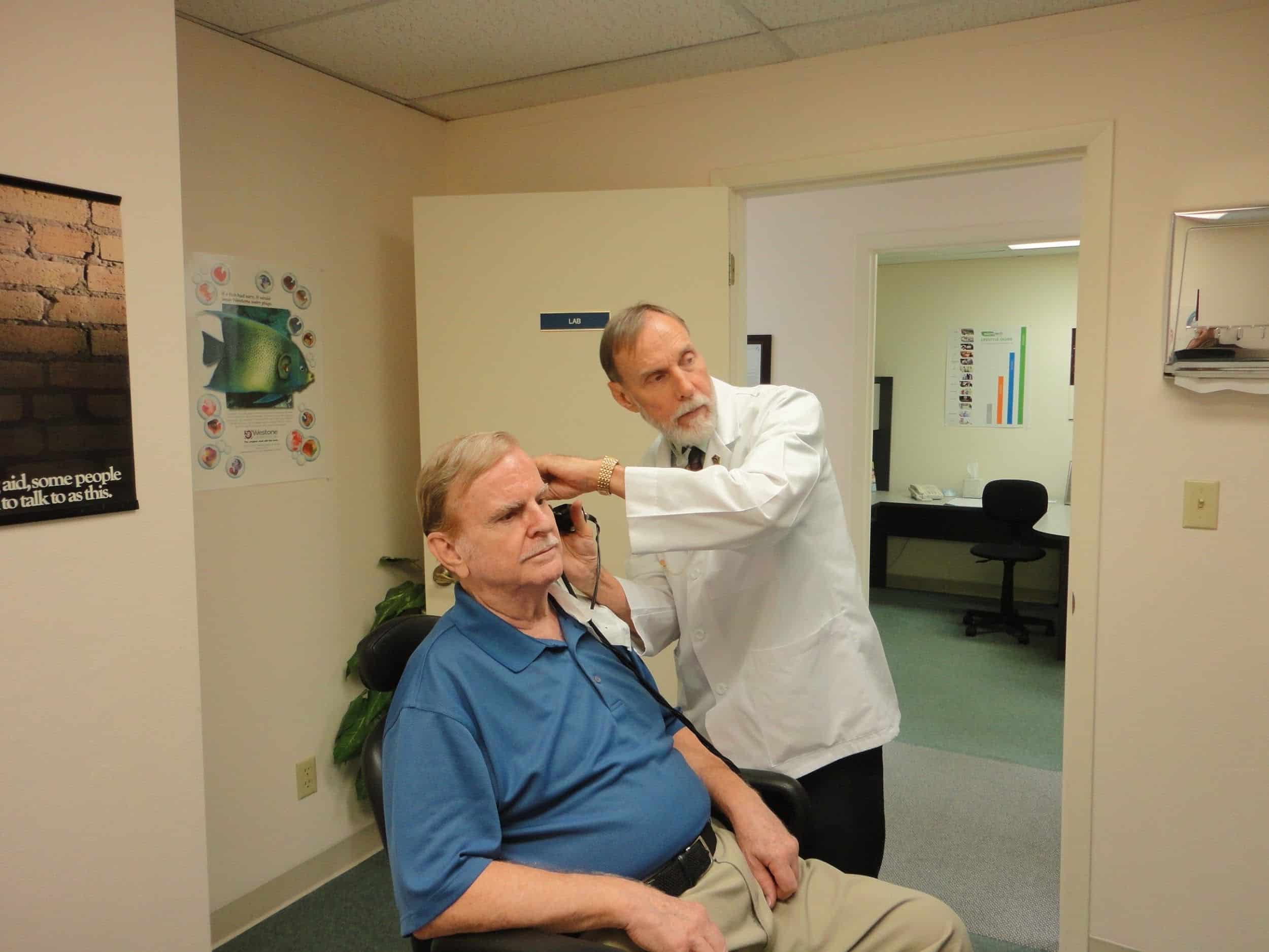 a patient getting a hearing exam